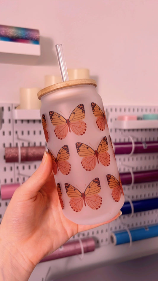 Glass cup with butterfly design