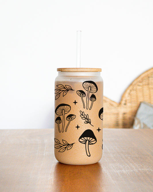 Glass mug with black mushroom design